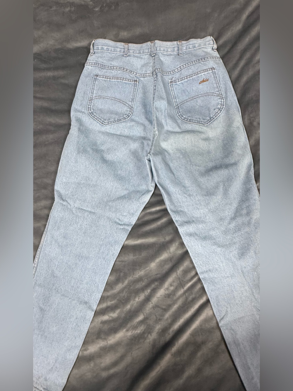 Chic Light Blue Denim Jeans with Tan Stitching